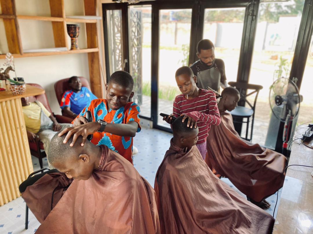 Bana Mayele orphans learning Hairdressing